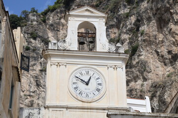 Fototapeta na wymiar The clock of the Church of San Salvatore de Birecto in Atrani, It