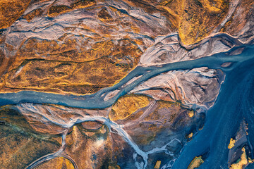 Abstract glacier rivers pattern flowing through volcanic lava field in Icelandic highlands