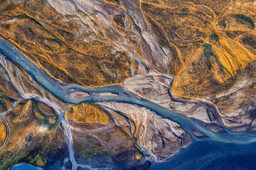 Abstract glacier rivers pattern flowing through volcanic lava field in Icelandic highlands