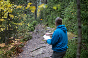 person aiming to throw a disc 