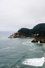 Scenic view of Heceta Head Lighthouse on the coastline of Oregon by historic route 101
