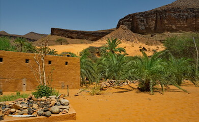 West Africa. Mauritania. Huts made of sand and stone in a village in the south of the Sahara Desert near the Terzhit oasis.