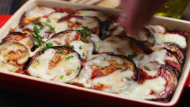 Baked eggplant with cheese mozzarella and tomatoes. Healthy eating. Italian food. Parmigiana di melanzane.