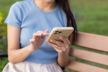 Woman use of mobile phone at park