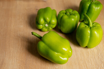 green peppers on a wooden background. healthy food and fresh food.