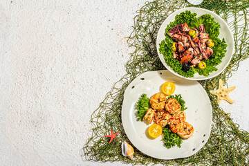 Set of salads with grilled shrimp and octopus, vegetables and spices. Fresh and healthy seafood