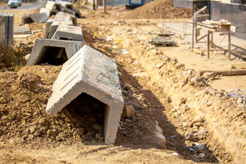 Construction and installation of ditches for drainage in the city. Rain ditches are being repaired...