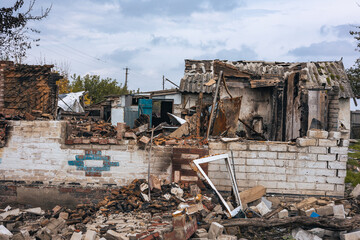 Fototapeta na wymiar War in Ukraine, a house destroyed by an explosion in a village, Kharkiv region