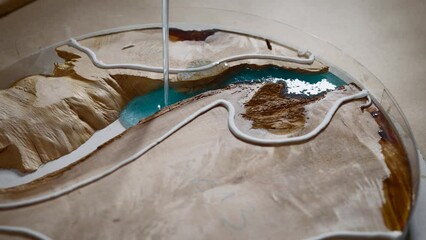 Manufacture of decorative kitchen appliances made of wood and epoxy resin.