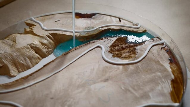 Manufacture of decorative kitchen appliances made of wood and epoxy resin.