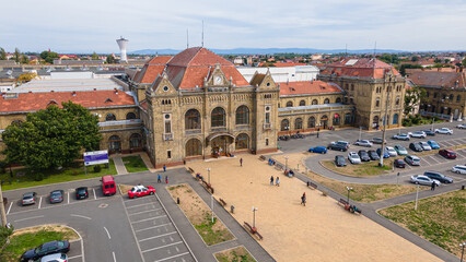 Aerial photography of the train station in Arad city, Romania. Photography was taken from a drone at a lower altitude capturing the train station building.