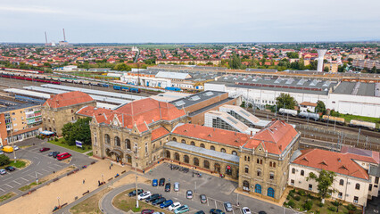 Aerial photography of the train station in Arad city, Romania. Photography was taken from a drone at a lower altitude capturing the train station building.