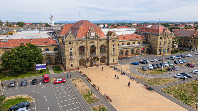 Aerial photography of the train station in Arad city, Romania. Photography was taken from a drone at a lower altitude capturing the train station building.