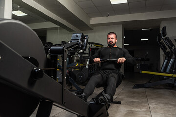 Strongman training on indoor rower
