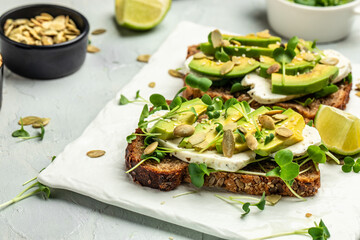 avocado toasts with rye bread, Delicious breakfast or snack, Clean eating, dieting, vegan food concept. top view