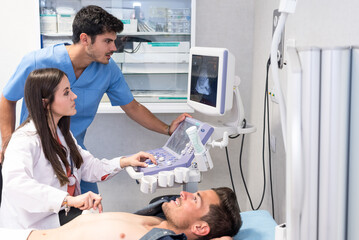 Doctor examining patient with ultrasound scan