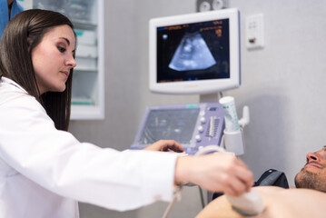 Doctor examining patient with ultrasonic