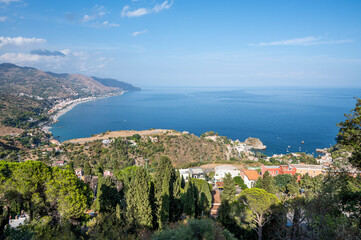 Aerial wide angle view of Taormina and its beautiful coastline