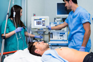 Fototapeta premium Doctors preparing patient in hospital