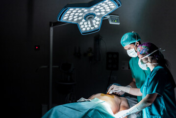 Doctors during operation in hospital operating room