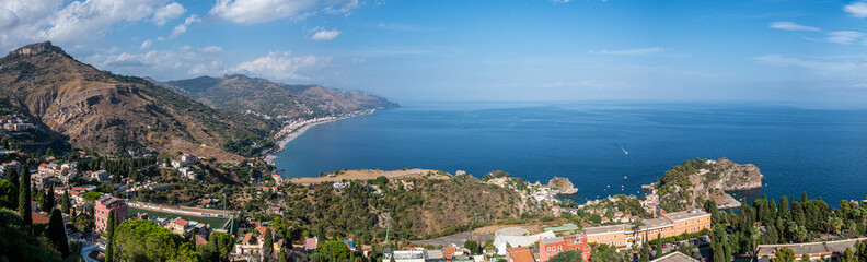 Fototapeta na wymiar Aerial wide angle view of Taormina and its beautiful coastline