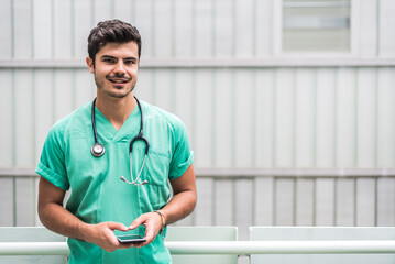Male doctor using smartphone outdoors
