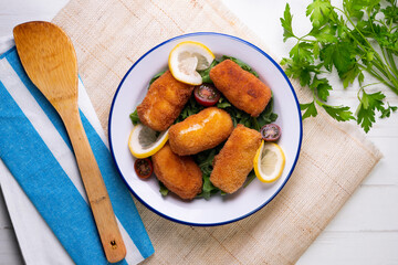 Fish croquettes. Traditional tapas of the coastal areas in Spain.