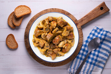 Braised pork with red wine sauce and mushrooms. Traditional northern Spanish tapas.