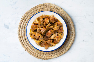 Braised pork with red wine sauce and mushrooms. Traditional northern Spanish tapas.