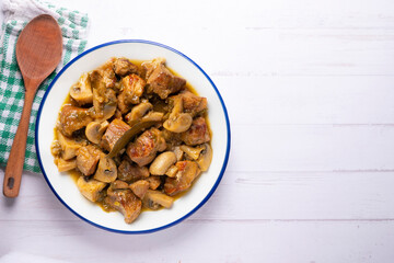 Braised pork with red wine sauce and mushrooms. Traditional northern Spanish tapas.