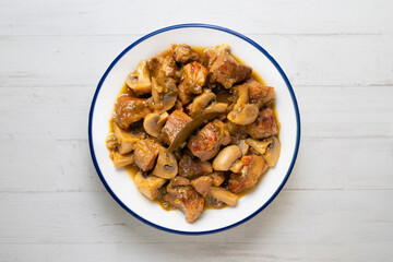 Braised pork with red wine sauce and mushrooms. Traditional northern Spanish tapas.