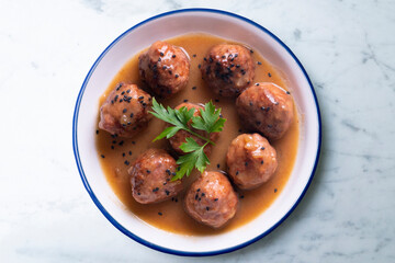 Tapa of beef meatballs with red wine sauce. Traditional Spanish recipe.