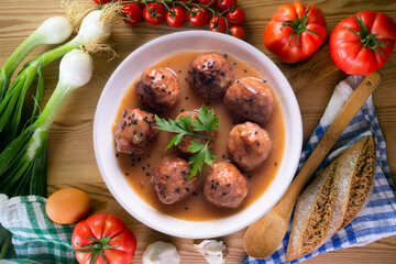 Tapa of beef meatballs with red wine sauce. Traditional Spanish recipe.