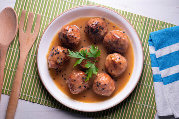 Tapa of beef meatballs with red wine sauce. Traditional Spanish recipe.