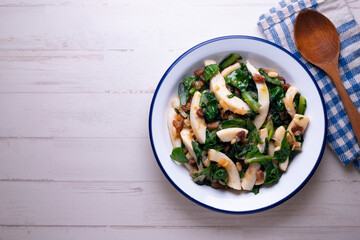 Cuttlefish cooked with chard and spinach. Spanish traditional tapas.