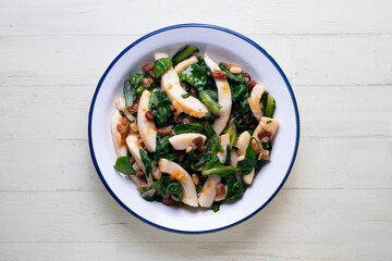 Cuttlefish cooked with chard and spinach. Spanish traditional tapas.