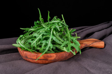 Fresh Arugula Salad leaves on white background