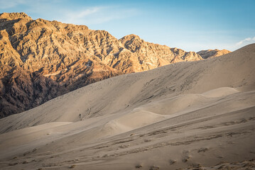 Fototapeta na wymiar Sun Sets across Eureka Dunes Death Valley
