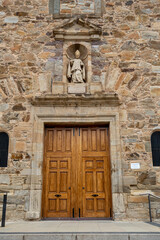 Fototapeta na wymiar Entrance door and image in the Church of Perpetuo Socorro, Astorga, Spain. Santiago's road.