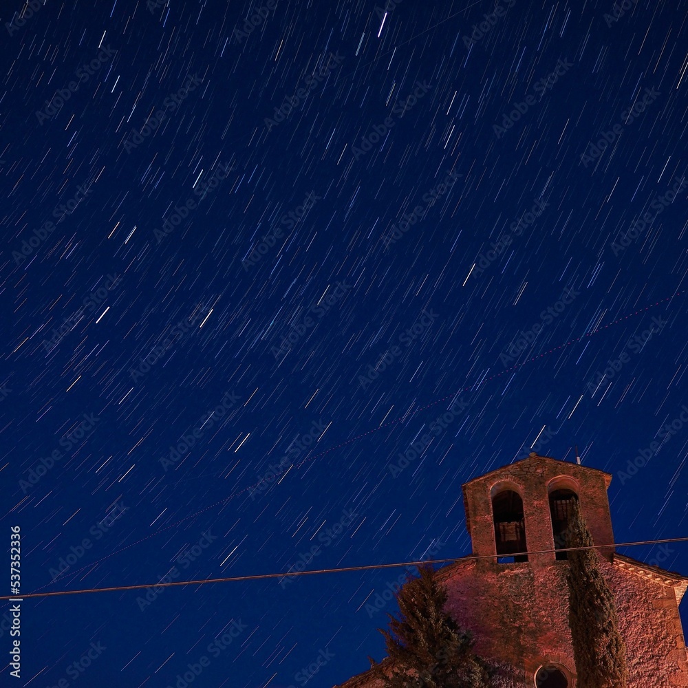 Sticker Star trail over an old church