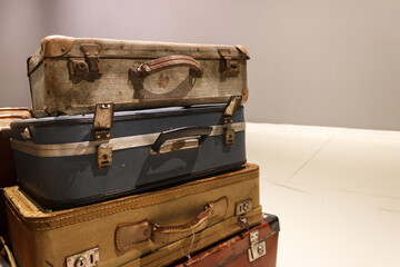 Old vintage leather suitcases close-up. Travel luggage concept. 