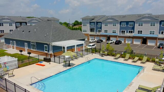This video shows aerial shots of the new, modern construction apartment complex.