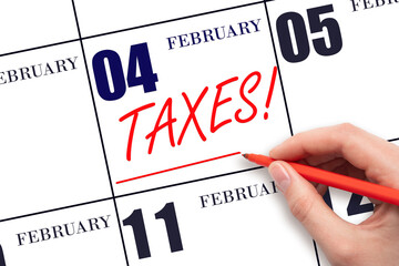 Hand drawing red line and writing the text Taxes on calendar date February 4. Remind date of tax payment