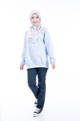 Portrait of a beautiful Muslim female model wearing modern and stylish casualwear with hijab isolated white studio background. Modern hijab fashion and beauty concept