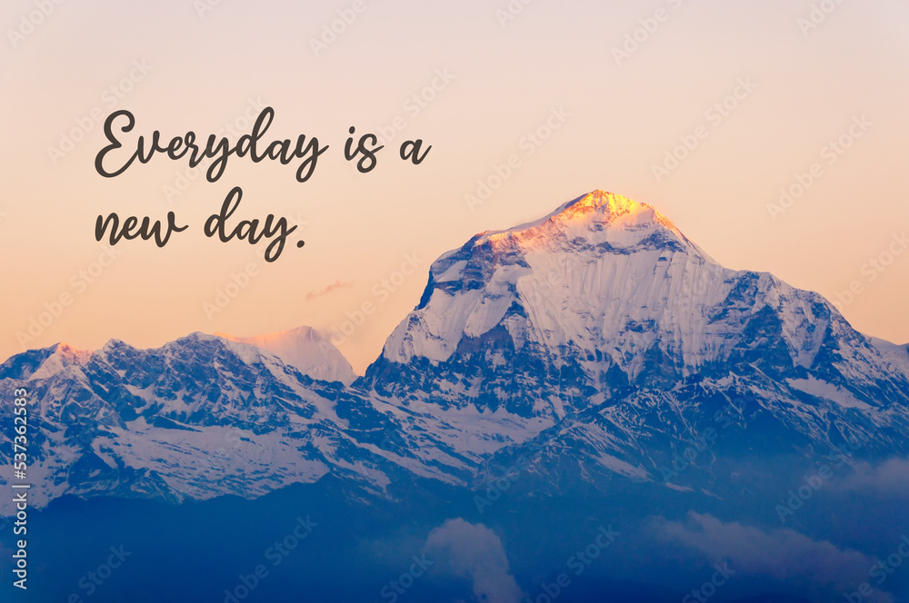 Wall mural snow capped mountain background with inspirational quotes text - everyday is a new day