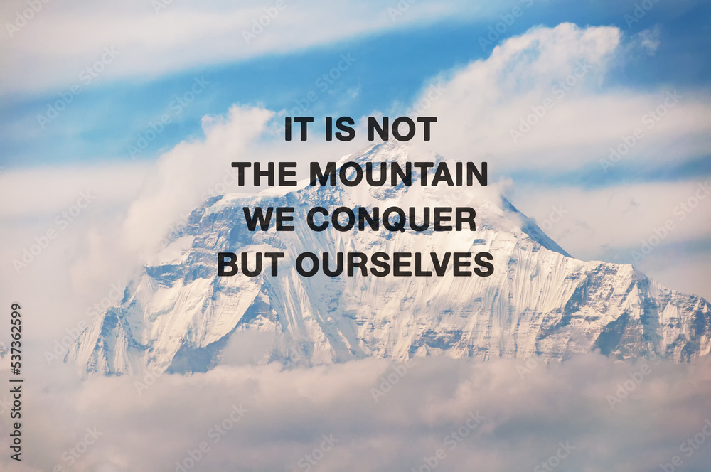 Wall mural snow capped mountain background with inspirational quotes text - it is not the mountain we conquer b