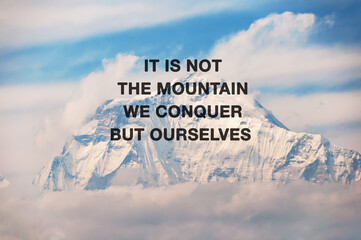 Snow capped mountain background with inspirational quotes text - It is not the mountain we  conquer...