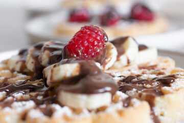 Chocolate-covered banana and raspberry waffles, dessert	