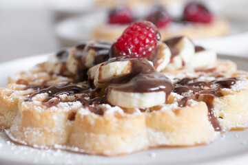 Chocolate-covered banana and raspberry waffles, dessert	