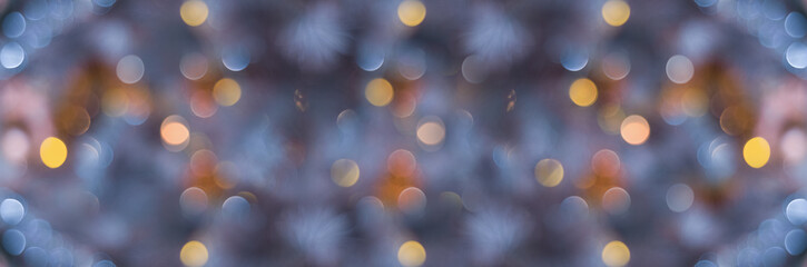 Widescreen background for winter holidays. Blue blurred abstract banner with multicolored bokeh
